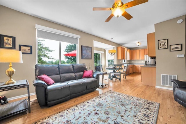 2420 Columbia Ln, Montgomery, IL 60538 - living room with a ceiling fan and light wood-style floors