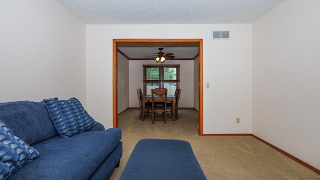 410 Wildberry Dr, Normal, IL 61761 - living area featuring carpet, crown molding, and a ceiling fan
