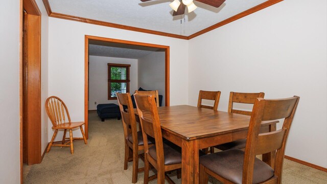 410 Wildberry Dr, Normal, IL 61761 - dining room featuring light carpet, ceiling fan, and crown molding