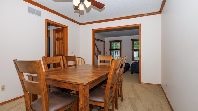 410 Wildberry Dr, Normal, IL 61761 - dining room with light colored carpet, ceiling fan, and ornamental molding