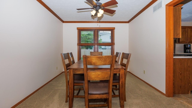 410 Wildberry Dr, Normal, IL 61761 - dining room featuring light colored carpet, crown molding, and ceiling fan