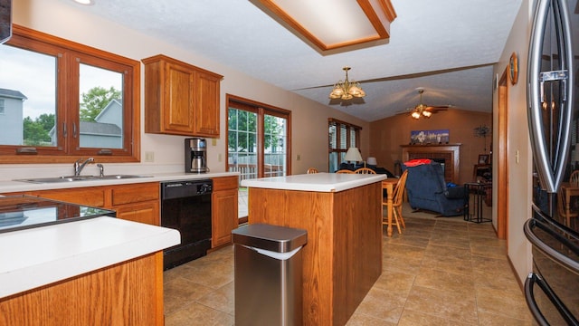 410 Wildberry Dr, Normal, IL 61761 - kitchen featuring dishwasher, lofted ceiling, freestanding refrigerator, a center island, and brown cabinetry