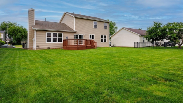 410 Wildberry Dr, Normal, IL 61761 - rear view of property with a chimney, a deck, and roof with shingles