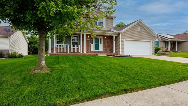 410 Wildberry Dr, Normal, IL 61761 - view of front of house with a porch, an attached garage, concrete driveway, and a front yard