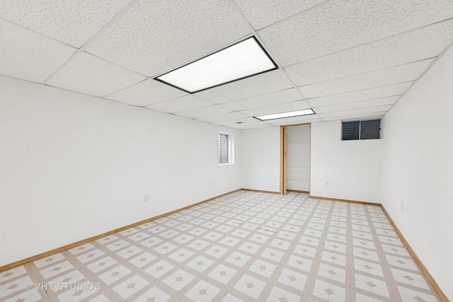 614 Hillview Ct, West Chicago, IL 60185 - below grade area with a paneled ceiling and baseboards