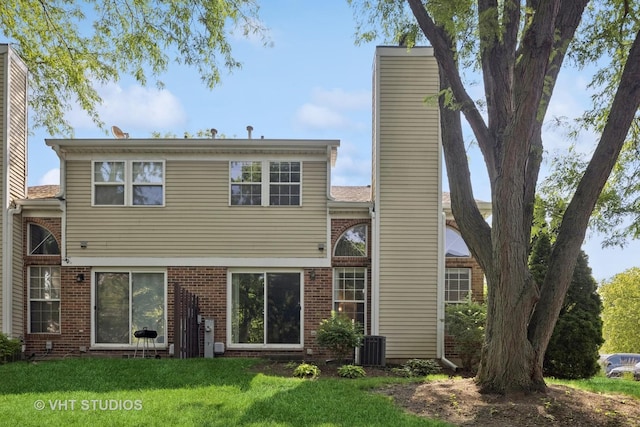 614 Hillview Ct, West Chicago, IL 60185 - back of property with a chimney and a lawn