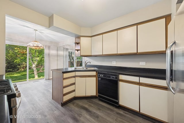 614 Hillview Ct, West Chicago, IL 60185 - kitchen with appliances with stainless steel finishes, a peninsula, dark countertops, dark wood-type flooring, and cream cabinetry