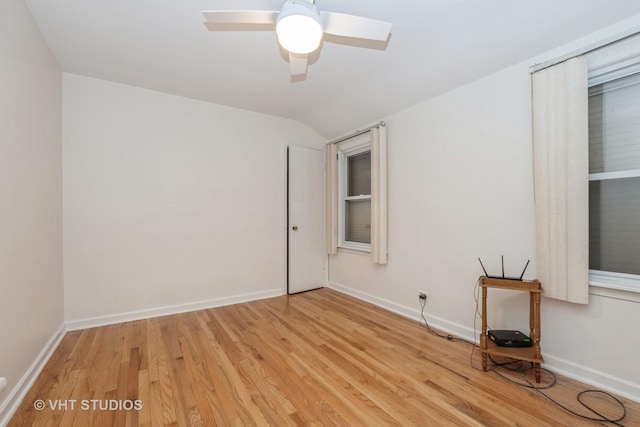 9739 S Ellis Ave, Chicago, IL 60628 - spare room with light wood-style flooring, vaulted ceiling, and a ceiling fan