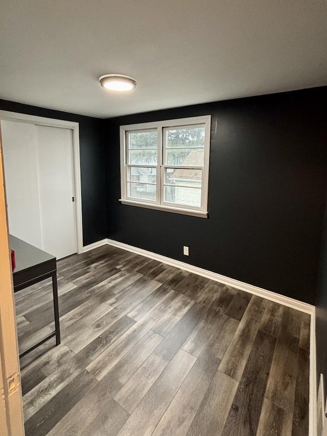 1221 Nicholson St, Joliet, IL 60435 - unfurnished bedroom featuring wood finished floors and a closet