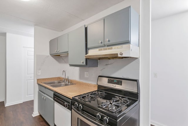 5011 Valley Ln Unit 201, Streamwood, IL 60107 - kitchen with stainless steel range with gas cooktop, under cabinet range hood, white dishwasher, gray cabinets, and dark wood finished floors
