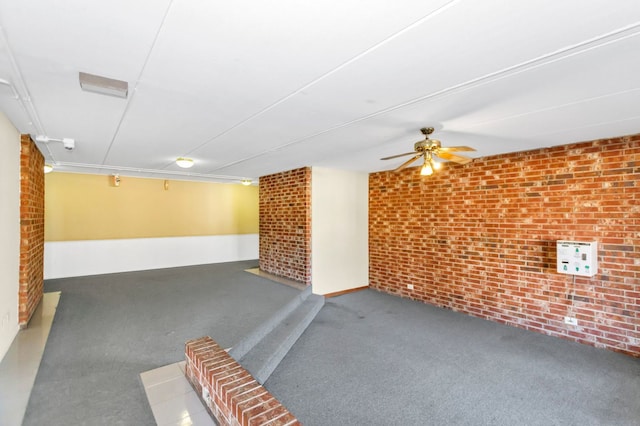 5011 Valley Ln Unit 201, Streamwood, IL 60107 - interior space featuring brick wall, carpet flooring, and ceiling fan