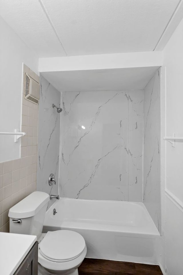 5011 Valley Ln Unit 201, Streamwood, IL 60107 - bathroom featuring vanity, tile walls, shower / tub combination, and wood finished floors