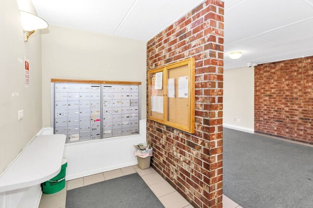 5011 Valley Ln Unit 201, Streamwood, IL 60107 - view of home's community with mail area and brick wall