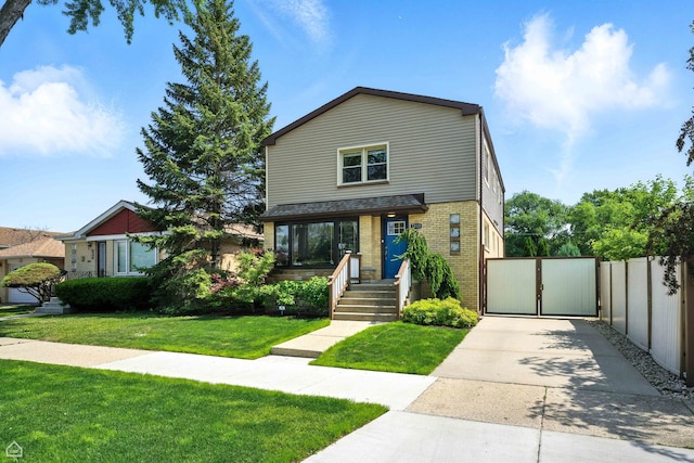 7515 W Roscoe St, Chicago, IL 60634 - view of front of property featuring brick siding, a gate, and concrete driveway