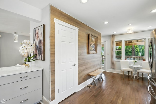 7515 W Roscoe St, Chicago, IL 60634 - foyer with wooden walls, recessed lighting, and dark wood-style flooring