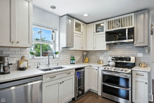 7515 W Roscoe St, Chicago, IL 60634 - kitchen featuring appliances with stainless steel finishes, wine cooler, glass insert cabinets, dark wood-style flooring, and backsplash