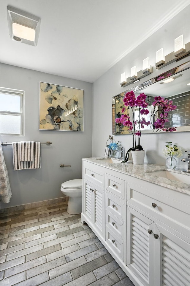 7515 W Roscoe St, Chicago, IL 60634 - bathroom with vanity and wood finished floors