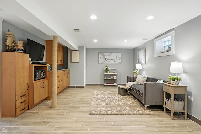 7515 W Roscoe St, Chicago, IL 60634 - living area with light wood-style floors and recessed lighting