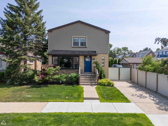 7515 W Roscoe St, Chicago, IL 60634 - view of front of property with brick siding and a porch