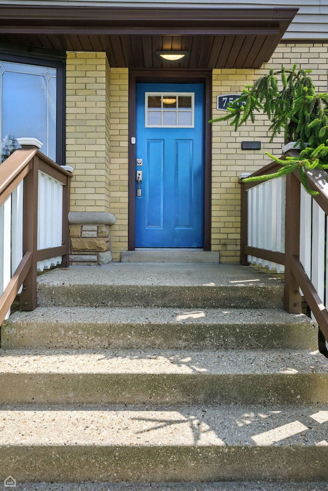 7515 W Roscoe St, Chicago, IL 60634 - doorway to property featuring brick siding