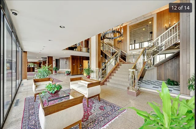 3200 N Lake Shore Dr Unit 1709, Chicago, IL 60657 - building lobby with stairway, a security system, and wood walls