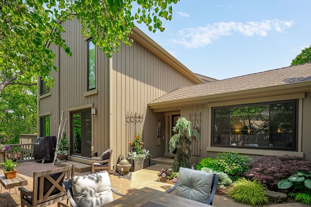 303 Bluff Ct Unit 303, Barrington, IL 60010 - rear view of house with a patio area and a shingled roof
