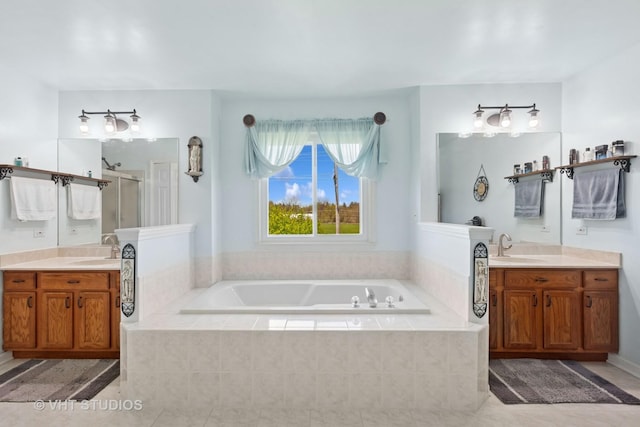 387 Essex Dr, Oswego, IL 60543 - full bath featuring a stall shower, a bath, two vanities, and tile patterned floors