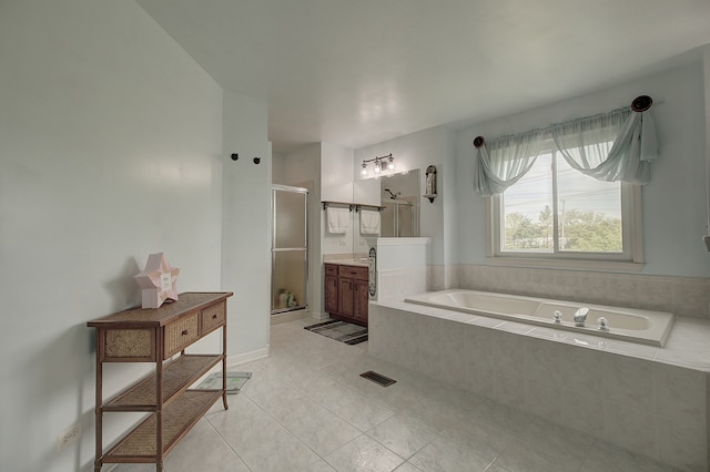 387 Essex Dr, Oswego, IL 60543 - bathroom featuring vanity, a shower stall, tile patterned flooring, and a bath