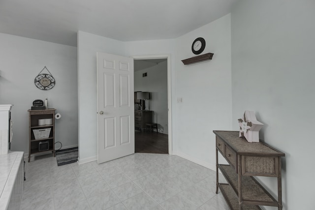387 Essex Dr, Oswego, IL 60543 - interior space featuring baseboards and light tile patterned flooring