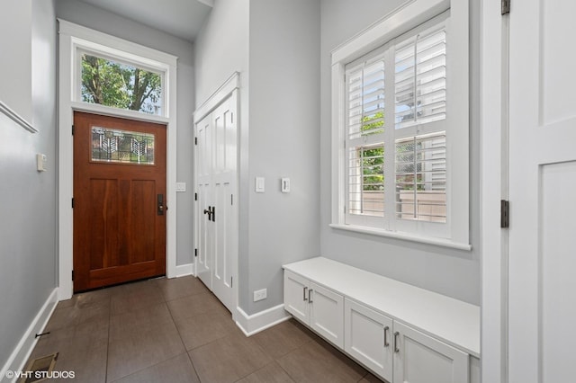3715 N Wayne Ave, Chicago, IL 60613 - foyer entrance featuring healthy amount of natural light and dark tile patterned floors