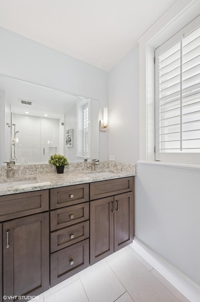 3715 N Wayne Ave, Chicago, IL 60613 - full bath with double vanity, a shower stall, and tile patterned flooring