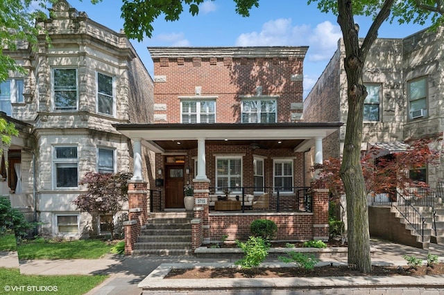 3715 N Wayne Ave, Chicago, IL 60613 - view of front facade with a porch, brick siding, and stairway