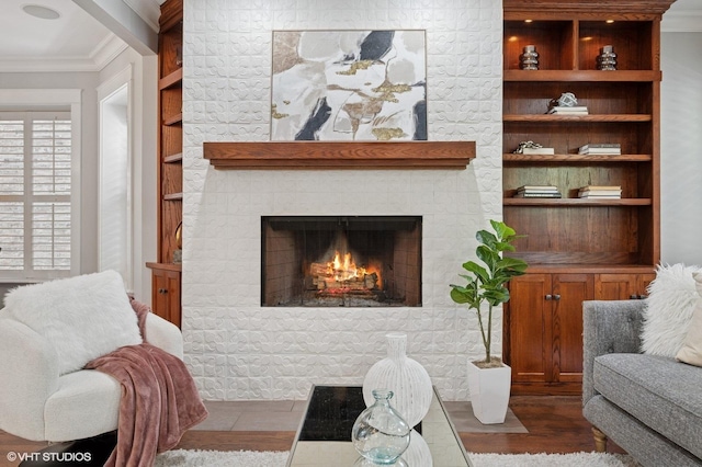 3715 N Wayne Ave, Chicago, IL 60613 - living room with dark wood-style flooring, a brick fireplace, crown molding, and built in features