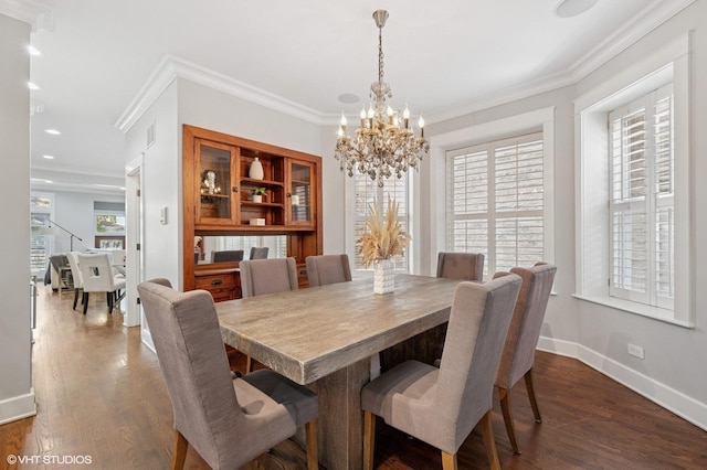 3715 N Wayne Ave, Chicago, IL 60613 - dining space featuring a chandelier, crown molding, dark wood-style flooring, and recessed lighting