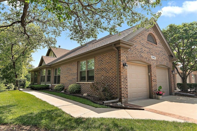 10401 Lismore Ct, Orland Park, IL 60462 - view of side of home with brick siding, driveway, a shingled roof, a yard, and an attached garage