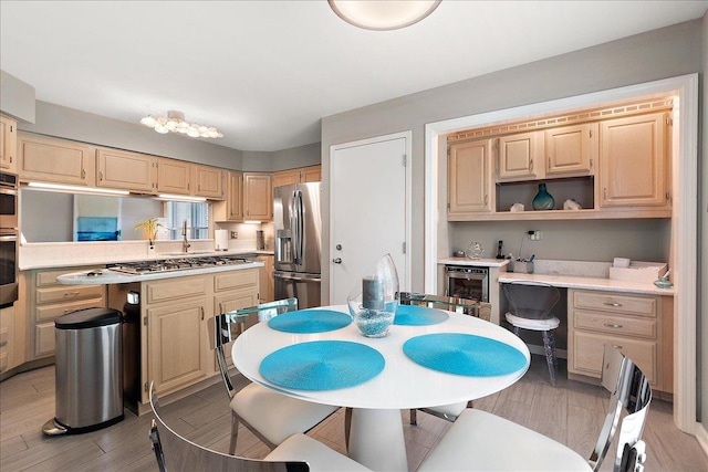 10401 Lismore Ct, Orland Park, IL 60462 - kitchen featuring appliances with stainless steel finishes, light countertops, light wood-type flooring, and light brown cabinets