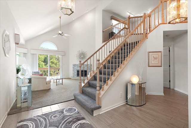 10401 Lismore Ct, Orland Park, IL 60462 - staircase with wood finished floors, high vaulted ceiling, and a ceiling fan