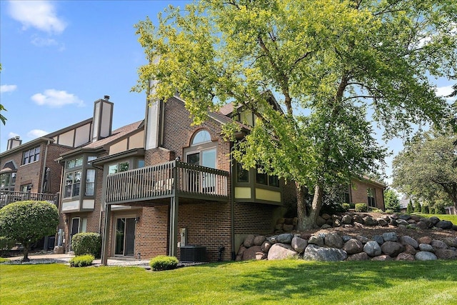 10401 Lismore Ct, Orland Park, IL 60462 - rear view of property with brick siding, a balcony, and a lawn