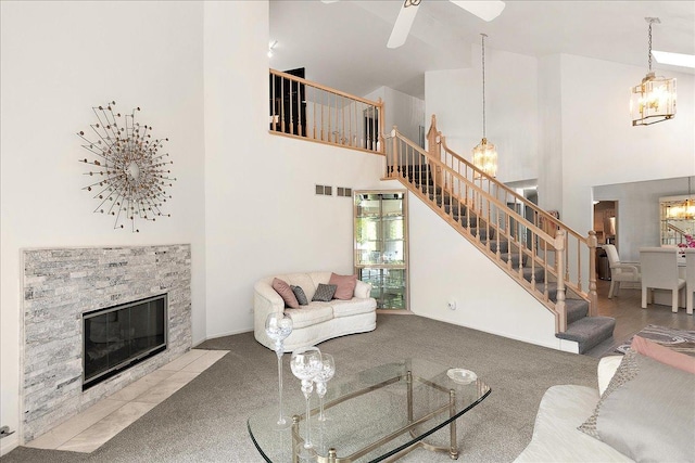 10401 Lismore Ct, Orland Park, IL 60462 - living area featuring stairway, high vaulted ceiling, a chandelier, carpet flooring, and a stone fireplace