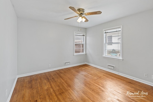 902 W Downer Pl, Aurora, IL 60506 - empty room featuring light wood-style flooring and a ceiling fan