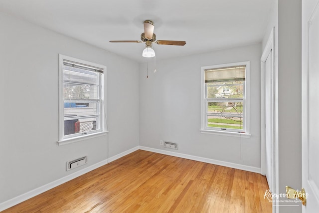 902 W Downer Pl, Aurora, IL 60506 - empty room with light wood-style flooring and ceiling fan