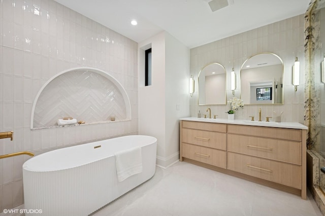 838 N Damen Ave Unit 1, Chicago, IL 60622 - full bath with tile walls, double vanity, and a freestanding tub