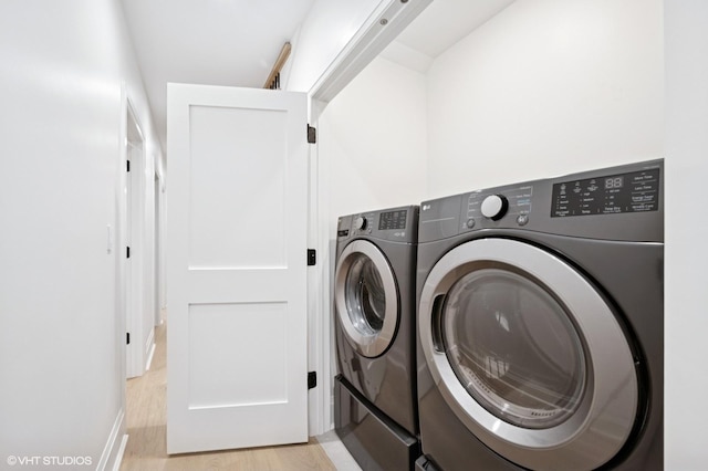 838 N Damen Ave Unit 1, Chicago, IL 60622 - laundry area featuring light wood-style flooring and washer and clothes dryer