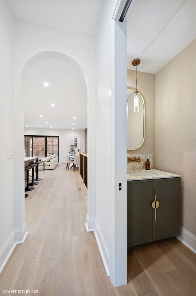 838 N Damen Ave Unit 1, Chicago, IL 60622 - corridor with arched walkways, light wood-type flooring, and recessed lighting