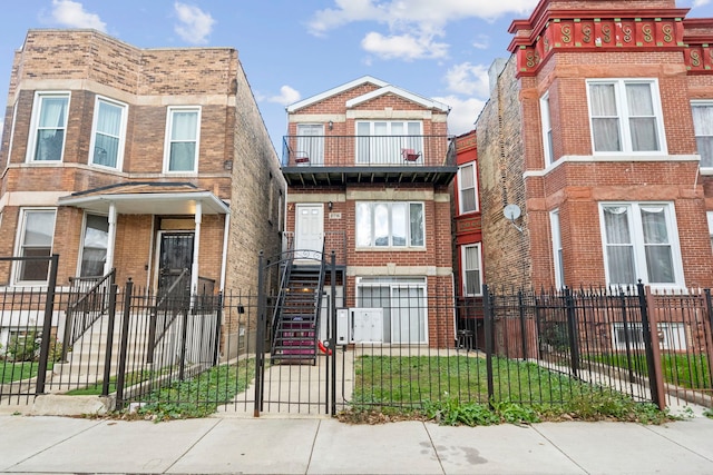 2716 W Polk St, Chicago, IL 60612 - view of front of home featuring a fenced front yard, brick siding, and stairs