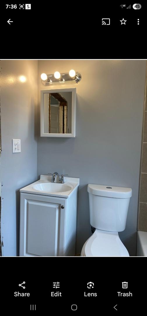 bathroom featuring vanity and toilet