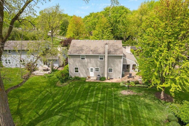 1228 N W St, Naperville, IL 60563 - rear view of property with a patio area, a lawn, and a chimney