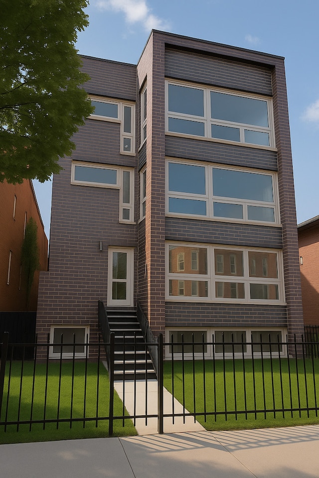 2147 W Adams St Unit 3N, Chicago, IL 60612 - view of front of house with a fenced front yard and brick siding