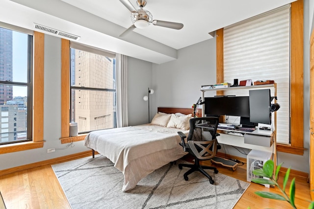 431 S Dearborn St Unit 1303, Chicago, IL 60605 - bedroom featuring multiple windows, wood finished floors, and an office area