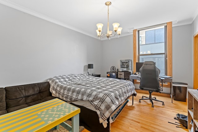431 S Dearborn St Unit 1303, Chicago, IL 60605 - bedroom featuring ornamental molding, light wood finished floors, a chandelier, and a desk